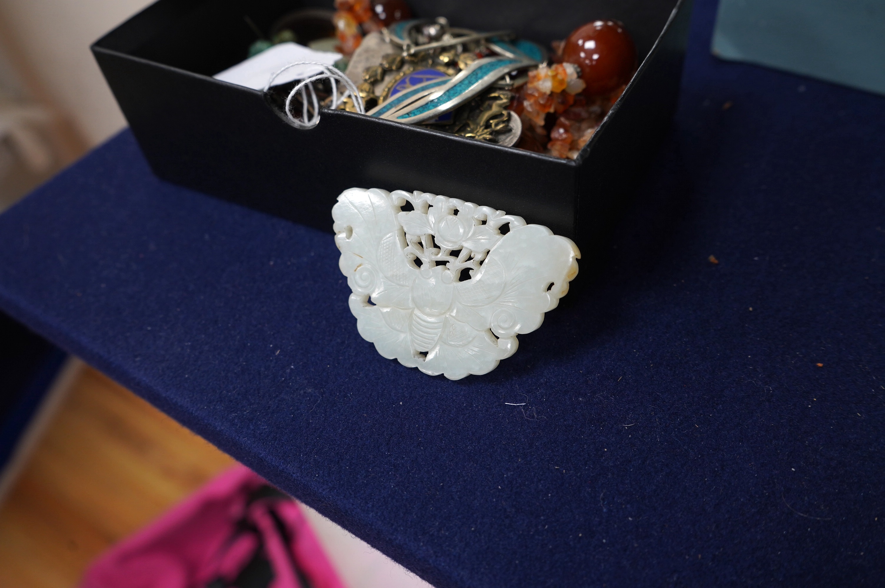 A Chinese reticulated jade ‘butterfly’ plaque , late Qing dynasty, 7cm wide. Condition - good